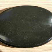 Highly polished shungite palm stone 70 x 40 mm. The palm stones are made from the best grade rough materials to produce a well finished, highly polished product. Used by crystal healers and general therapists for massage and similar treatments. Also perfect for collectors. Being a natural product these stones may have natural blemishes and vary in colour and banding. www.naturalhealingshop.co.uk based in Nuneaton for crystals, spiritual healing, meditation, relaxation, spiritual development,workshops.
